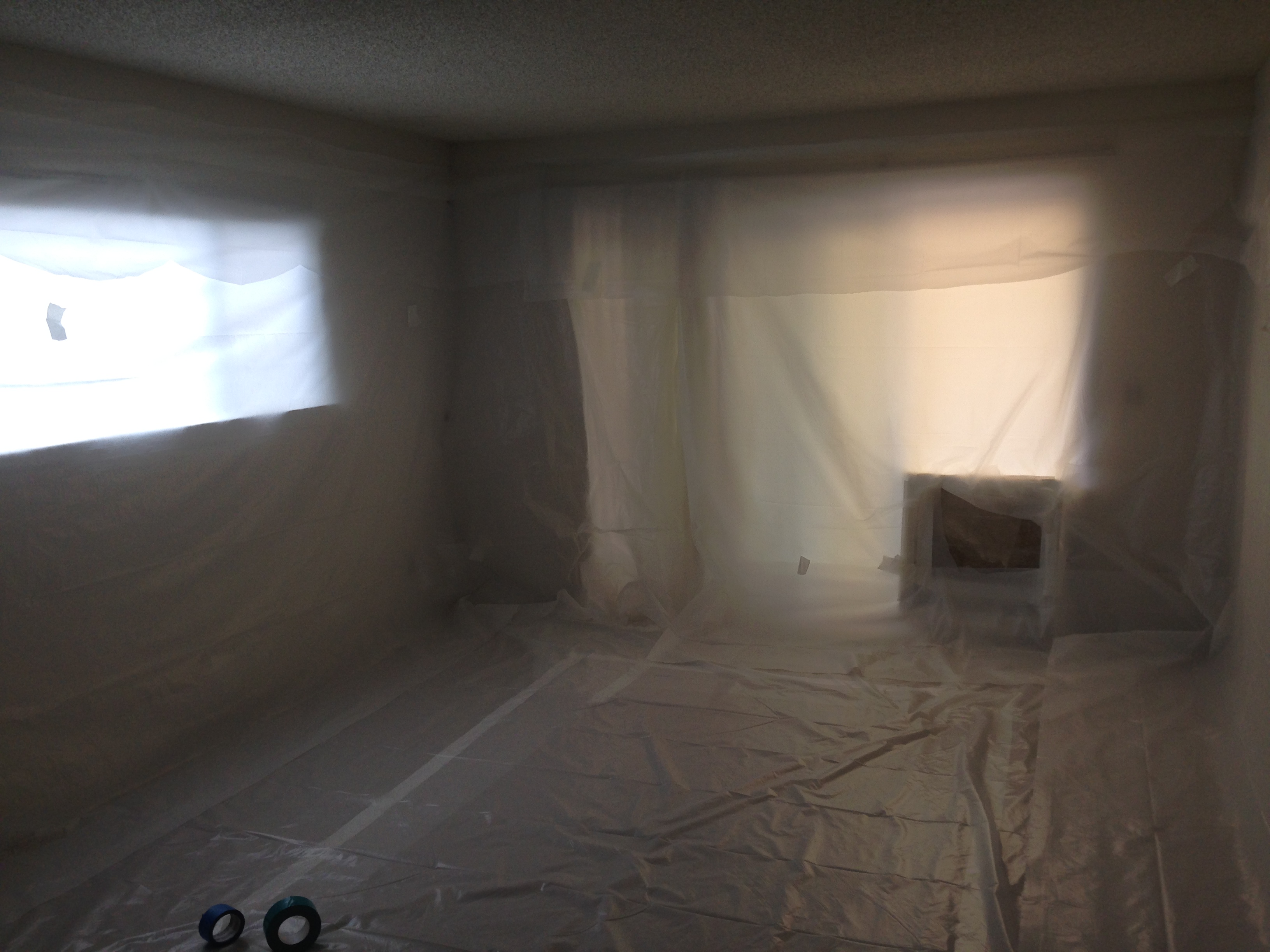 Acoustical Drywall Services worker doing popcorn ceiling removal on home in Livermore