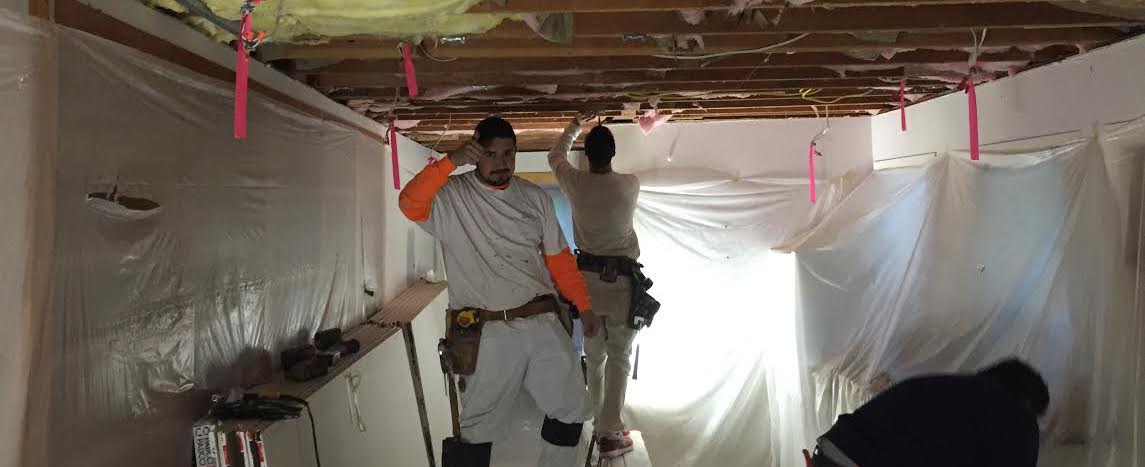 Acoustical Drywall Service employees doing popcorn ceiling removal