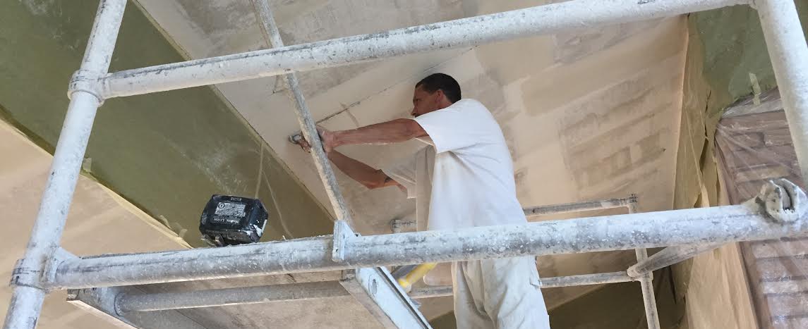 popcorn ceiling removal in Novato, CA being done by an Acoustical Drywall employee